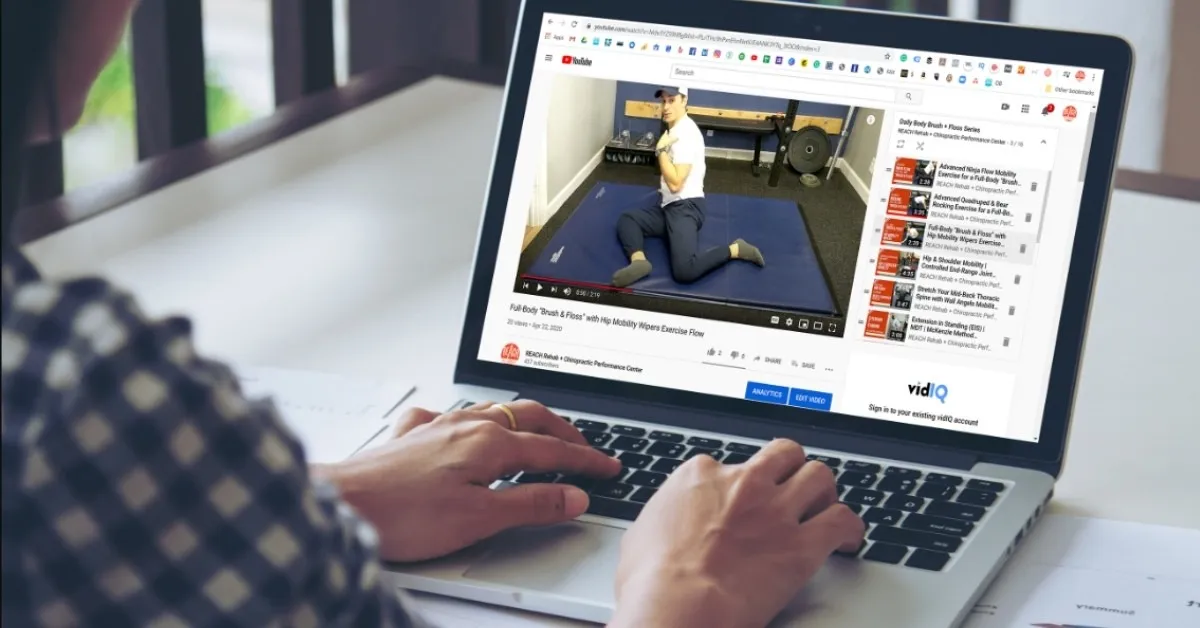 Watching movement education video on laptop