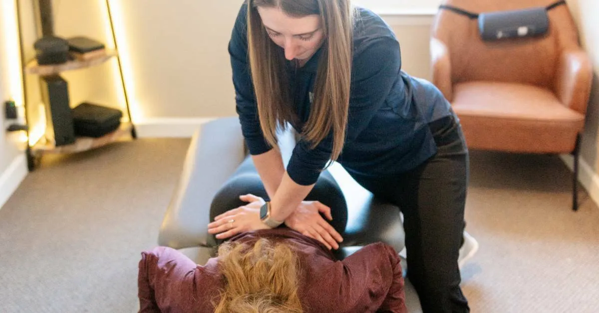 Dr. Sheridan Kent treating a patient at REACH Rehab + Chiropractic in Plymouth, MI
